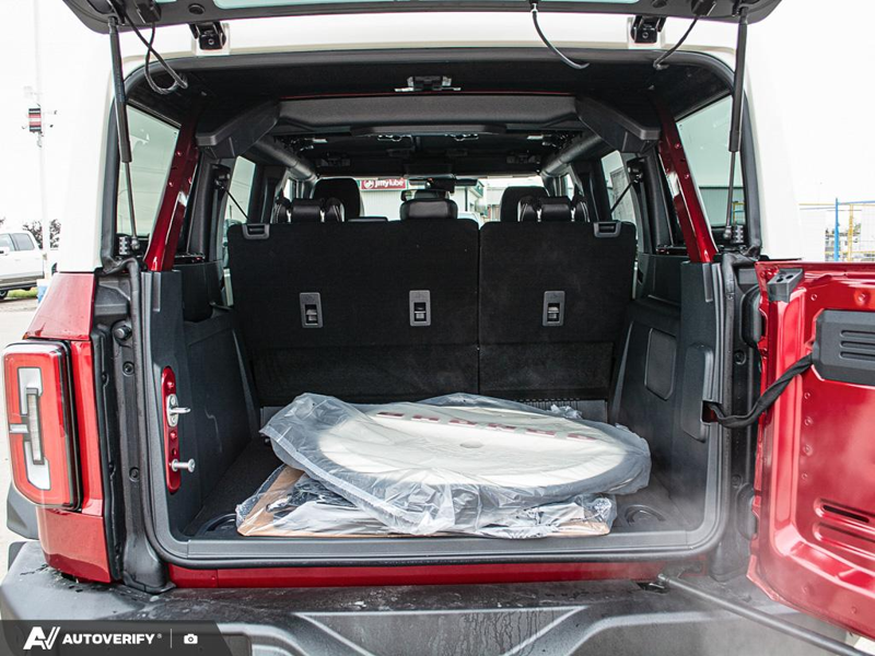 NEW 2026 Ford Bronco Outer Banks - Ruby Red Metallic Tinted Clearcoat Exterior / BLACK ONYX-LEATHER/VINYL Interior - $84,782 - Stock #D60778 - VIN 1FMEE8BP2TLB36841 - Photo 11