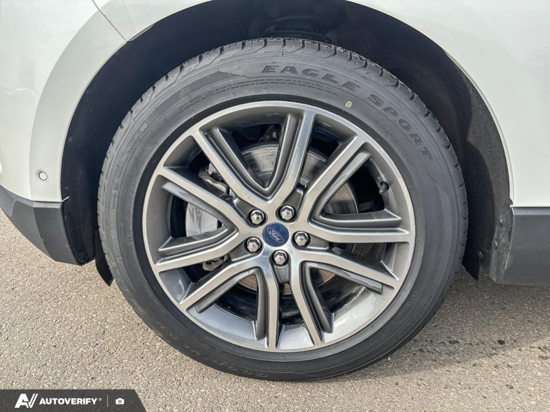 USED 2021 Ford Edge Titanium w/Leather, Moonroof, Nav, and More! - Star White Tri-coat Metallic Exterior / EBONY PERFORATED LEATHER Interior - $24,998 - Stock #D60205A - VIN 2FMPK4K95MBA55376 - Photo 6