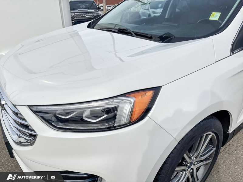 USED 2021 Ford Edge Titanium w/Leather, Moonroof, Nav, and More! - Star White Tri-coat Metallic Exterior / EBONY PERFORATED LEATHER Interior - $24,998 - Stock #D60205A - VIN 2FMPK4K95MBA55376 - Photo 7