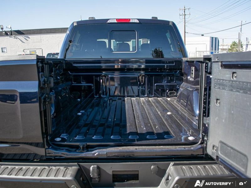 NEW 2026 Ford F-150 LARIAT - Antimatter Blue Metallic Exterior / BLACK, ACTIVEX TRIMMED 40/CONSOLE/40 FRONT SEATS (B) Interior - $85,914 - Stock #E61061 - VIN 1FTFW5L54TFB70859 - Photo 11