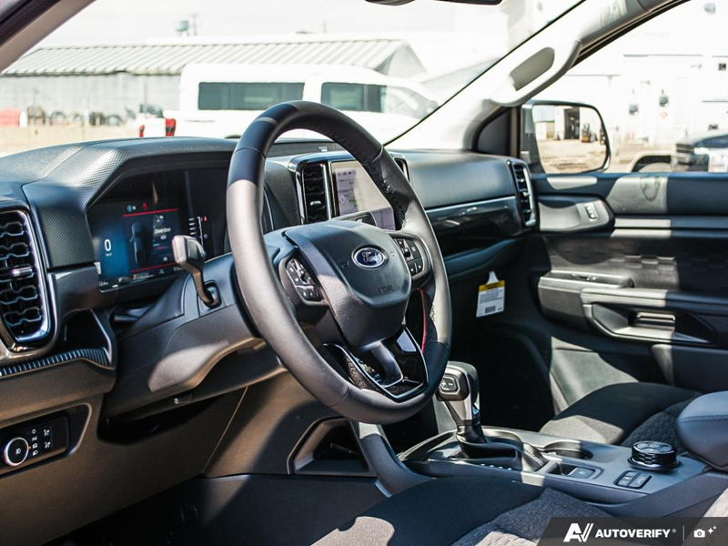 NEW 2026 Ford Ranger XLT - Oxford White Exterior / EBONY PREMIUM CLOTH Interior - $56,913 - Stock #E60297 - VIN 1FTER4HP7TLE04386 - Photo 13