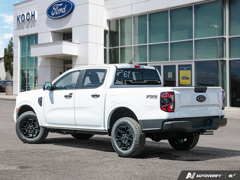 NEW 2026 Ford Ranger XLT - Oxford White Exterior / EBONY PREMIUM CLOTH Interior - $56,913 - Stock #E60309 - VIN 1FTER4HP2TLE04344 - Photo 4